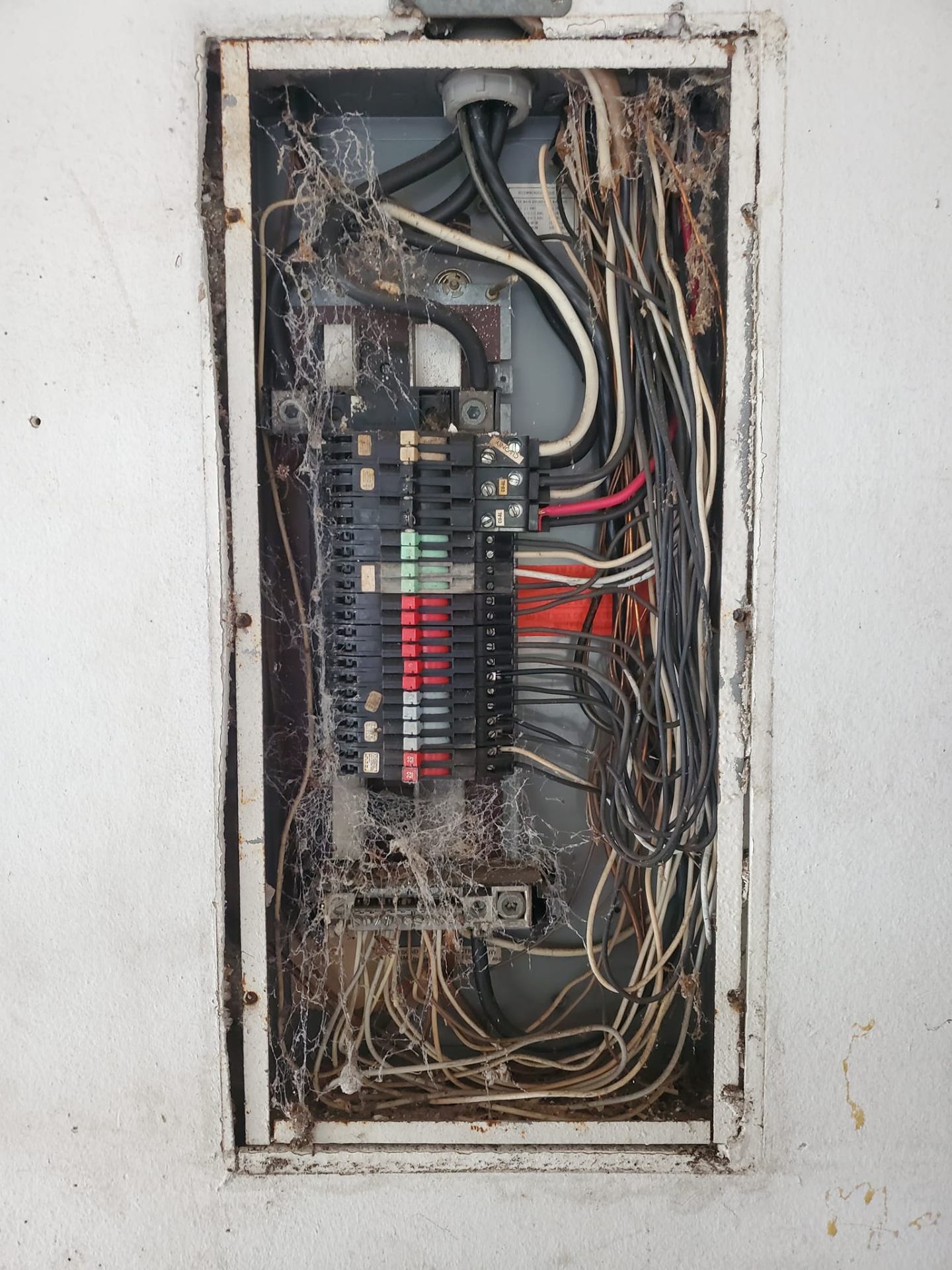 Before: Outdated electrical panel